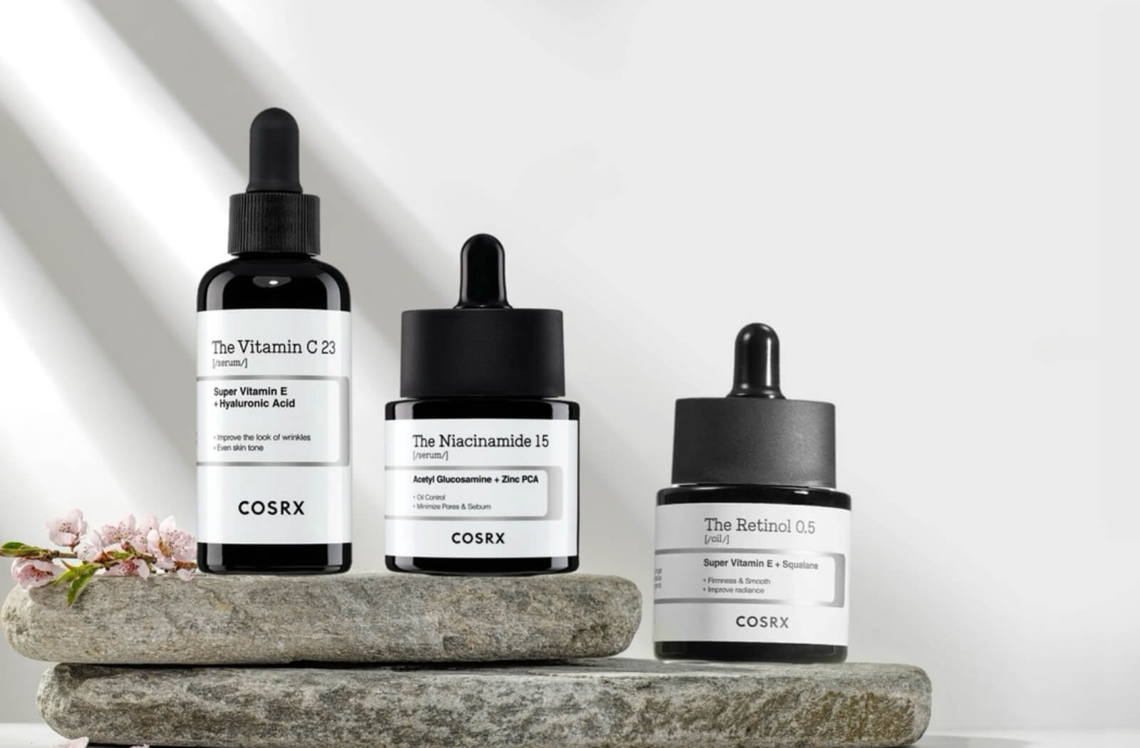 3 bottles of cosrx the derm serums with link to the product and link to the brand
