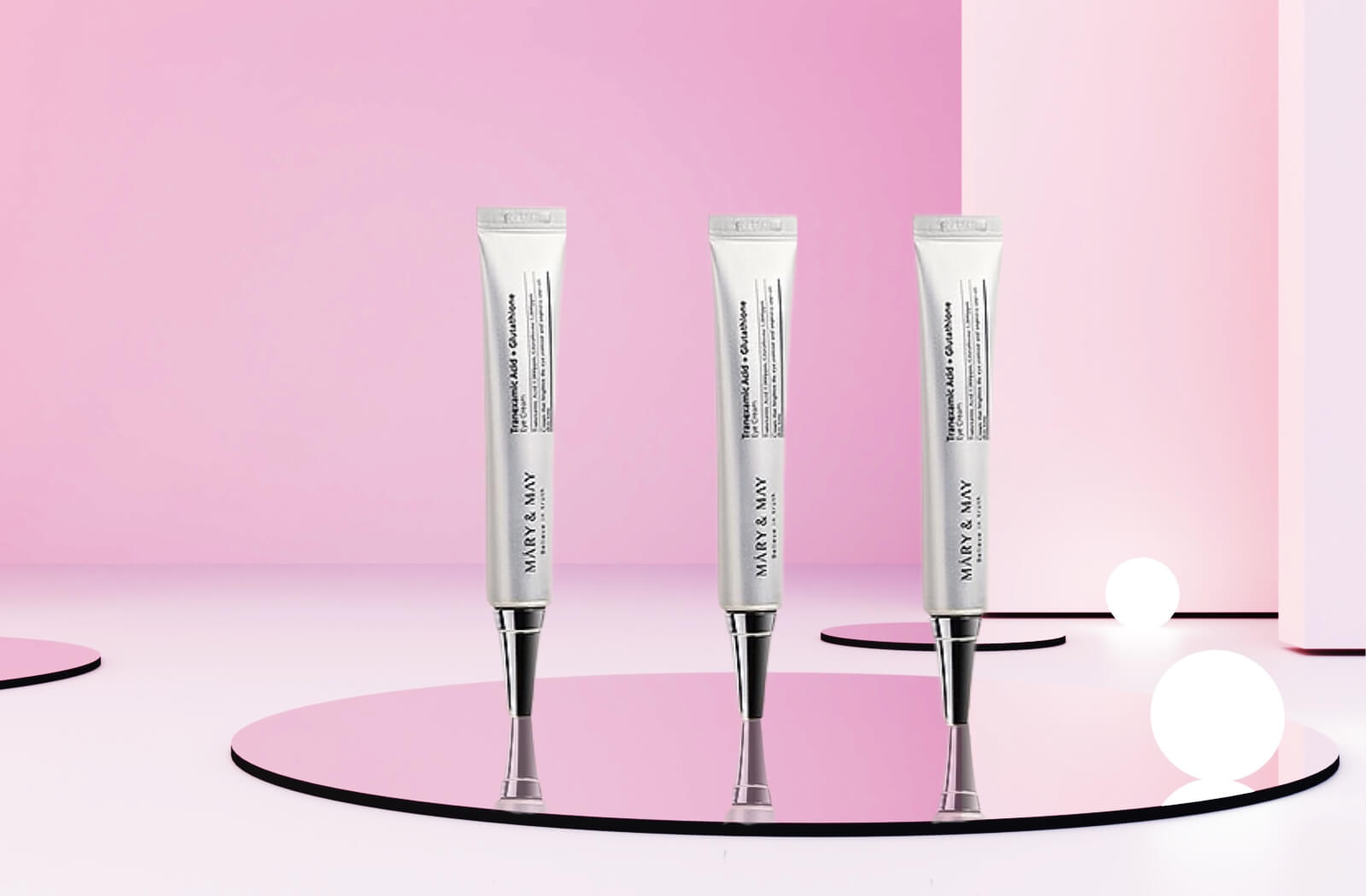 Pink image.3 tubes of Mary & May Eye Cream on a mirror 